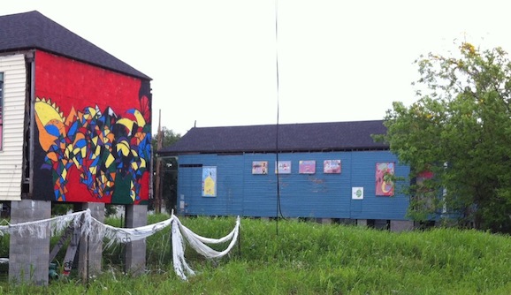 Volunteer artists have  adorned relocated houses with murals and missing architectural details. 