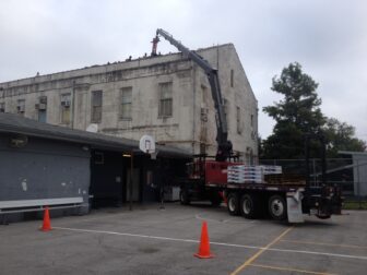 Roof repairs were ongoing at the Audubon Charter School's temporary campus on Carrollton Avenue on Saturday. The school is expected to move out of the campus early next year.