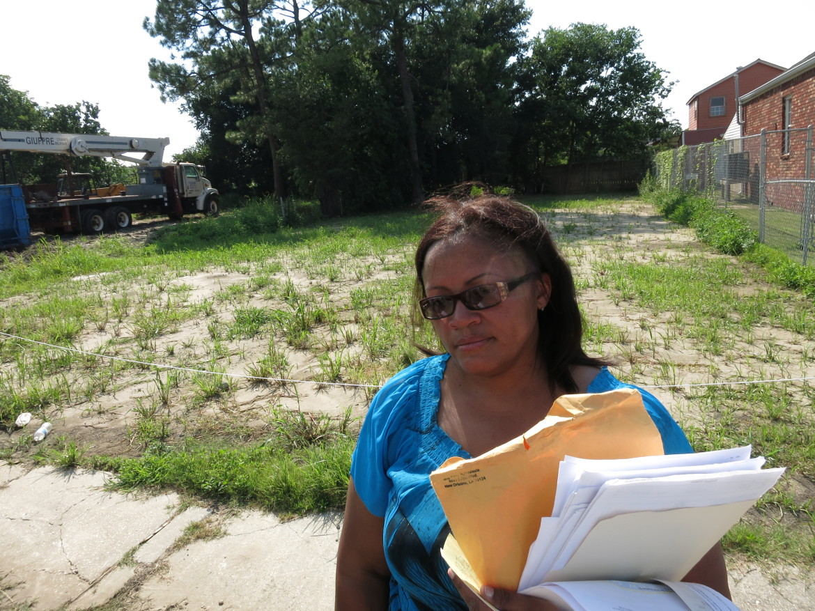 Kimberly James in front of former house on Pauline Street