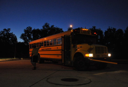 Jenny Joseph waves goodbye to her sons after they board their bus at 6 a.m. in eastern New Orleans last week.