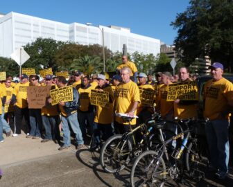 Firefighters protested outside City Hall before the start of Fridays budget hearings, which looked at the Fire Department's budget and under-funded pension.