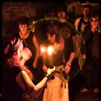 With candles to light the way between two worlds, Glassman leads a Day of the Dead rite in her Bywater peristyle or temple. 