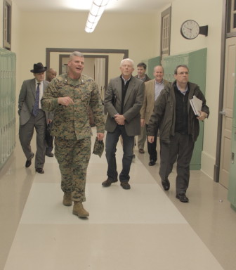 New Orleans Military and Maritime Academy Commandant Col. Bill Davis leads school board members on a tour of its new building.