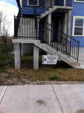A sign indicating an application for a zoning change is in front of Johnson's propert. 