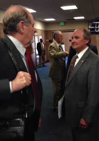 Adley has a quick moment with fellow Republican Jack Donahue of Mandeville in a Capitol corridor.