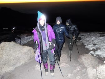 Nearing collapse, Glassman and her group make the final assault on Kilimanjaro's summit, with lamps on their heads to light the way.