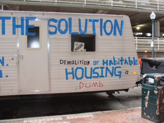 Part of the Hurricane Katrina recovery focused on demolition of damaged houses. The owner of this travel trailer suggested that demolition was not a the solution.