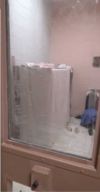 This image from a video shot inside Templeman V shows an inmate who has covered his window with soap and created a "cocoon" around his bunk to hide from guards. 