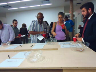 Citizen bean counters allocated their stash among glass bowls representing the various city agencies and departments.