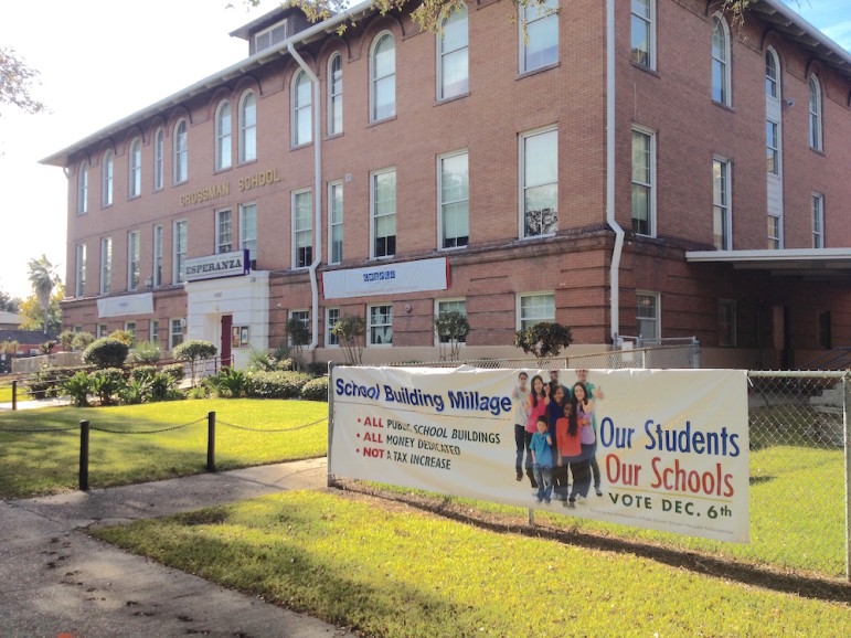 Signs such as this one at Esperanza charter school on South Carrollton Avenue are likely to be coming down soon at some campuses, after attorneys struck a deal with a Civil District Court Judge today. However, the board that oversees Esperanza wasn't named in the lawsuit, and it's not clear whether this sign will stay.