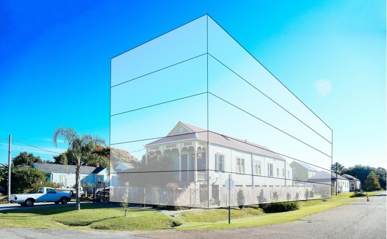 One of several buildings in the Perez firm's proposed condo cluster is superimposed over a traditional Holy Cross structure.