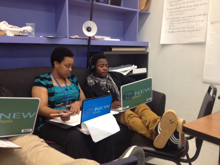 AmeriCorps member Arionne Hoskins works with student Michael Holmes, 19, on Spanish homework at ReNEW Accelerated High School. 