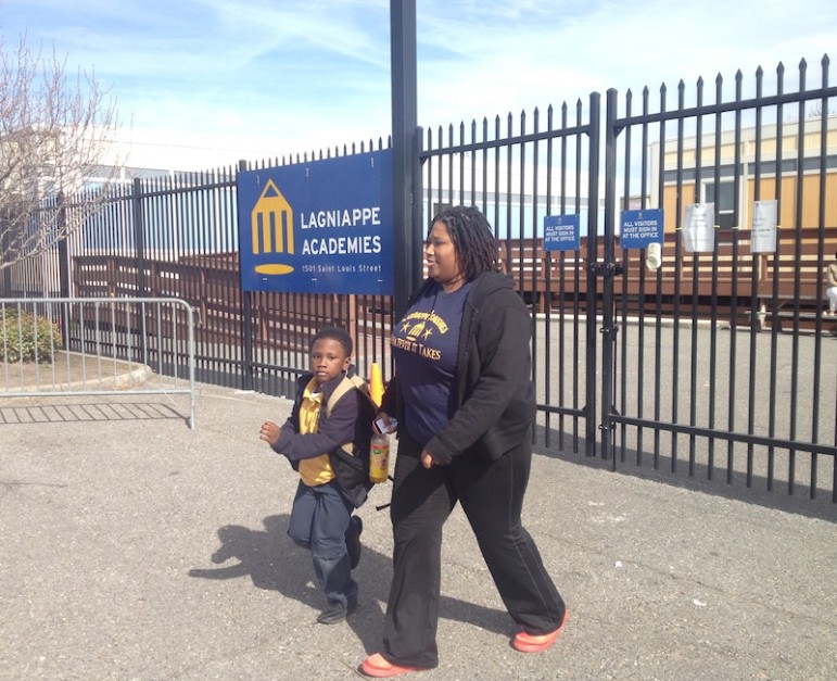 Alicia Parker leaves Lagniappe Academies with her son Anthony Jr. on Friday afternoon. The state voted that day to close the charter school, effective at the end of the year. Parker wishes new leadership would be put in place instead instead of shuttering the school.
