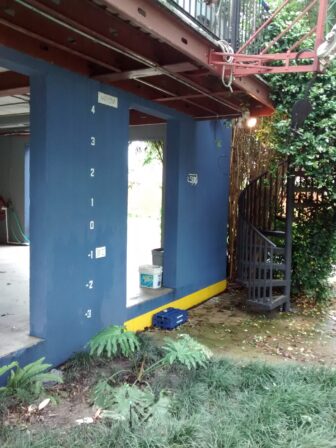 Marked like a ship's hull, the author's home highlights the difference between Katrina and the average flood.