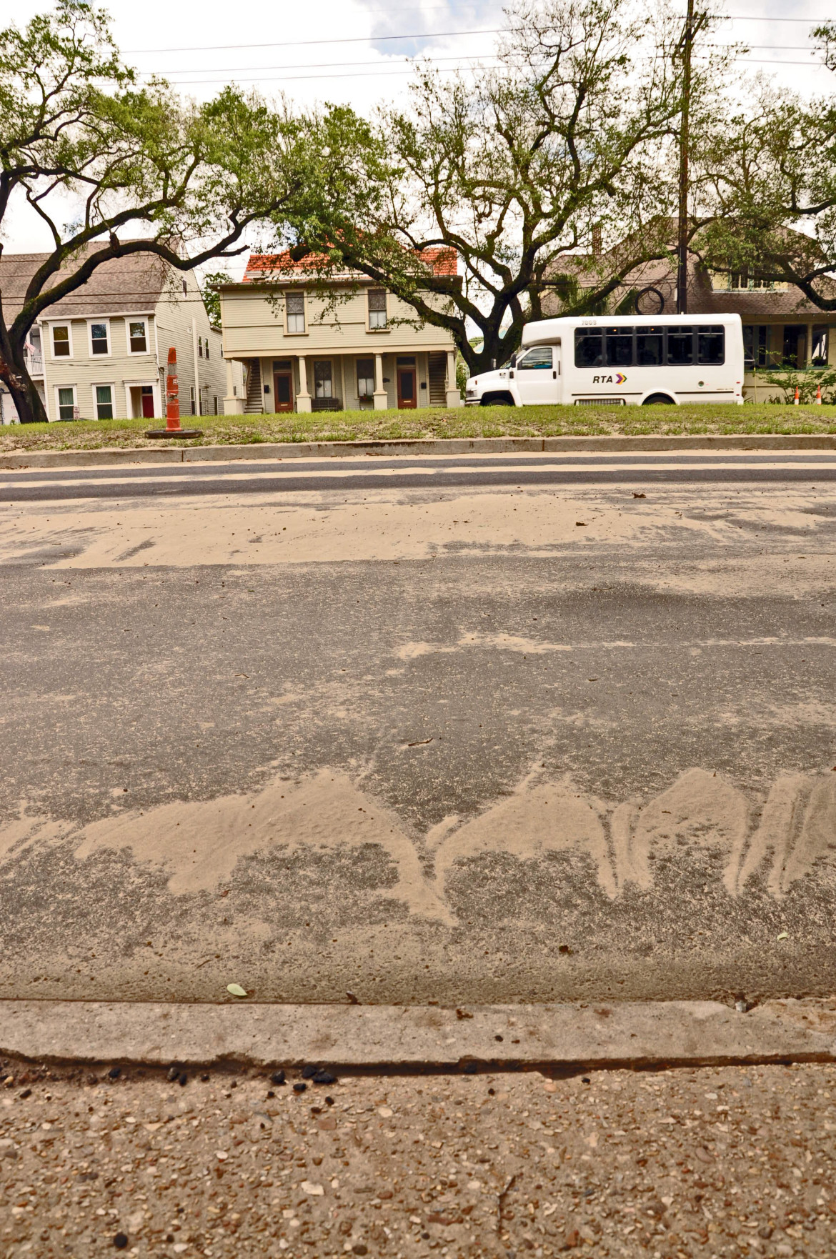 The top of the neutral ground being rebuilt on Napoleon Avenue by the Army Corps of Engineers rises far above the sidewalk side of the street in part because it is designed with a crown - meaning the center is higher than the sides. Opponents of the plan wanted the neutral ground to be flat or concave to reduce storm runoff going into the street.