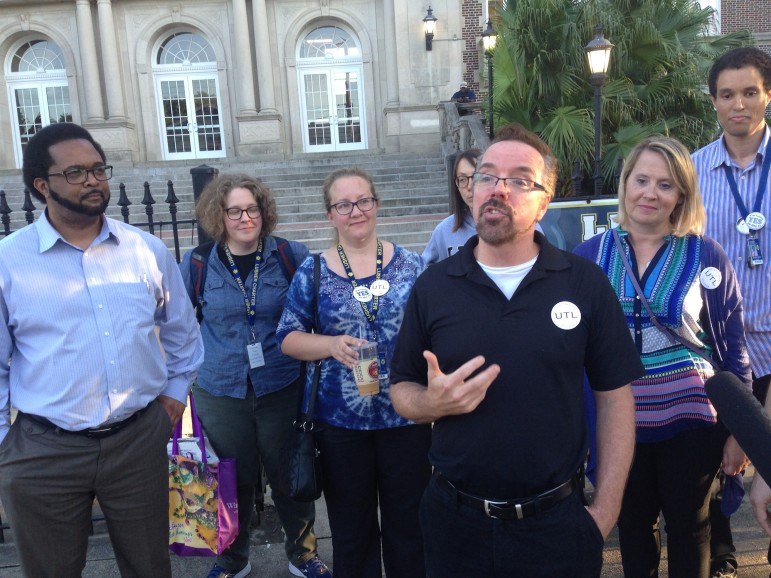 Theater teacher Terry Marek and other members of United Teacher of Lusher speak to reporters on May 17 after ballots were counted in the union election. Teachers voted against the union while teachers' aides voted for it.