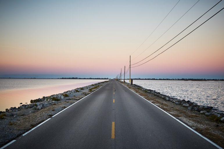 Island Road connects Pointe-au-Chien with Isle de Jean Charles, which has lost 98 percent of its island home since 1955. At high tide, the road is sometimes covered with water, making it impassable for school buses.